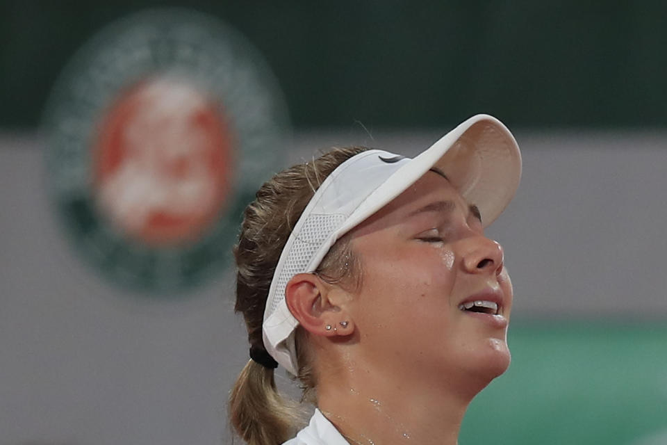 Amanda Anisimova of the U.S. reacts after missing a shot against Romania's Simona Halep in the third round match of the French Open tennis tournament at the Roland Garros stadium in Paris, France, Friday, Oct. 2, 2020. (AP Photo/Michel Euler)