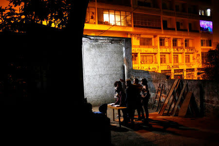 Silvana, Vitor, Teflon, Fernando and Fernanda, who are among members of lesbian, gay, bisexual and transgender (LGBT) community, that have been invited to live in a building that the roofless movement has occupied, stand outside the building, in downtown Sao Paulo, Brazil, November 26, 2016. REUTERS/Nacho Doce