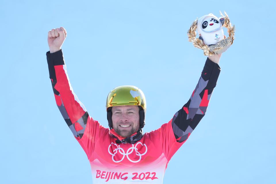 Gold medalist Benjamin Karl (AUT) celebrates on the podium during the snowboard parallel giant slalom during the Beijing 2022 Olympic Winter Games at Genting Snow Park on Feb 8, 2022.