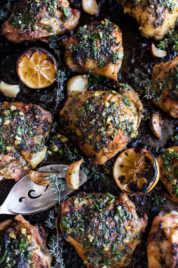 <strong>Get the <a href="http://www.halfbakedharvest.com/garlic-butter-roasted-chicken-thighs-with-charred-lemon-salsa-verde-asparagus/" target="_blank">Garlic Butter Roasted Chicken Thighs With Charred Lemon Salsa Verde recipe</a> from Half Baked Harvest</strong>