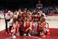 <p>Japan's team pose for a group picture after their defeat in the women's final basketball match between USA and Japan during the Tokyo 2020 Olympic Games at the Saitama Super Arena in Saitama on August 8, 2021. (Photo by Aris MESSINIS / AFP)</p> 