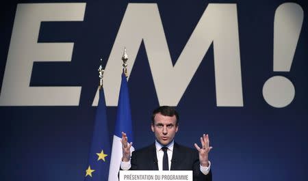 Emmanuel Macron, head of the political movement En Marche !, or Onwards !, and candidate for the 2017 French presidential election, speaks during a news conference to unveil his fully budgeted manifesto, named a "contract with the nation", in Paris, France, March 2, 2017. REUTERS/Christian Hartmann