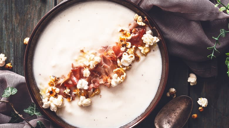 Soup garnished with popcorn