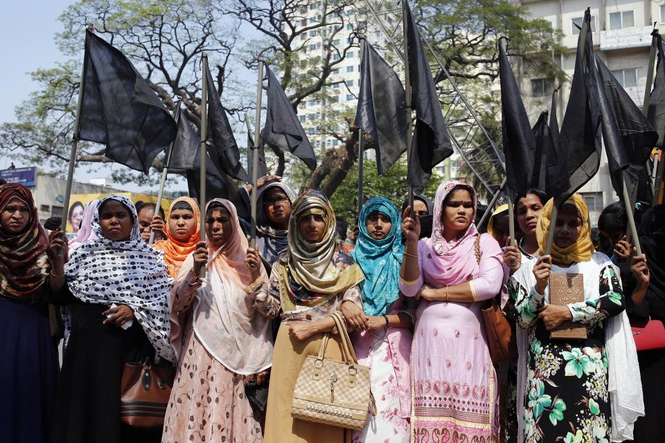 Activists from Bangladeshi women's organisations hold flags as they participate in an International Women's Day, 08 March 2019. EPA/MONIRUL ALAM: EPA