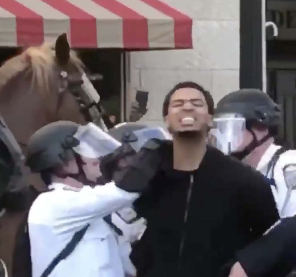 Seth Towns continued to shout, "Say his name!" as Columbus police detained him. (Twitter)