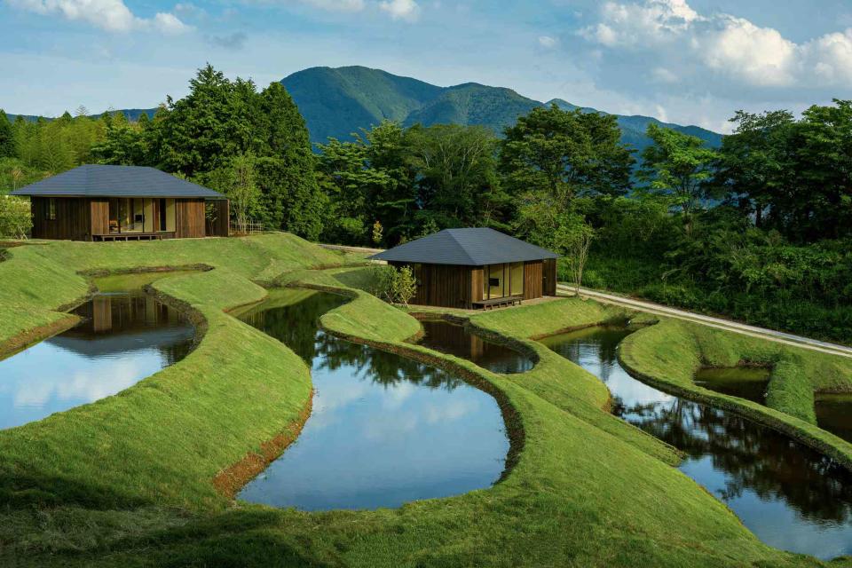 <p>Courtesy of Hoshino Resorts</p> Guest cabins at Kai Yufuin, a new resort surrounded by rice terraces on the Japanese island of Kyushu.