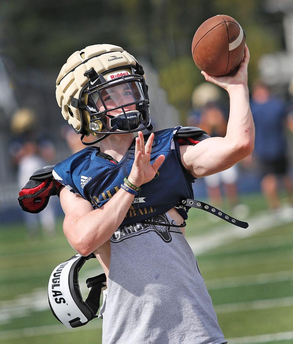 Senior quarterback Joe Schwartz, of Braintree, throws a pass during Archbishop Williams football practice in Braintree on Monday, Aug. 28, 2023.