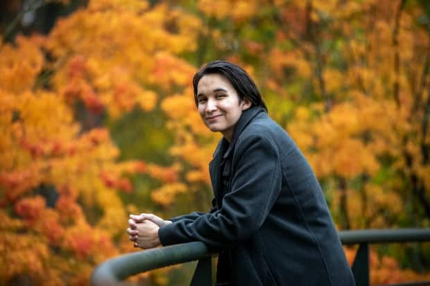 Jeremy Ratt, 20, host of the CBC podcast Pieces about exploring his Métis roots, says having a Gathering Room in his middle school was greatly beneficial because it gave him physical space to spend time with other Indigenous students and explore Indigenous culture. (Ben Nelms/CBC - image credit)