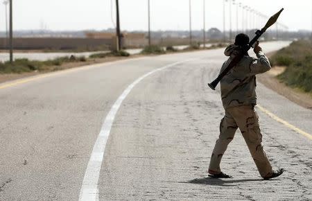 A Libya Dawn fighter shoulders a rocket-propelled grenade (RPG) launcher at a checkpoint near Sirte March 17, 2015. REUTERS/Goran Tomasevic