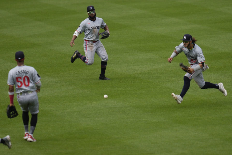 A ball hit by Baltimore Orioles' Ryan Mountcastle falls between Minnesota Twins' shortstop Willi Castro (50), left fielder Manuel Margot (13), and center fielder Austin Martin (82) for a single during the seventh inning of a baseball game, Wednesday, April 17, 2024, in Baltimore. The Orioles won 4-2. (AP Photo/Jess Rapfogel)