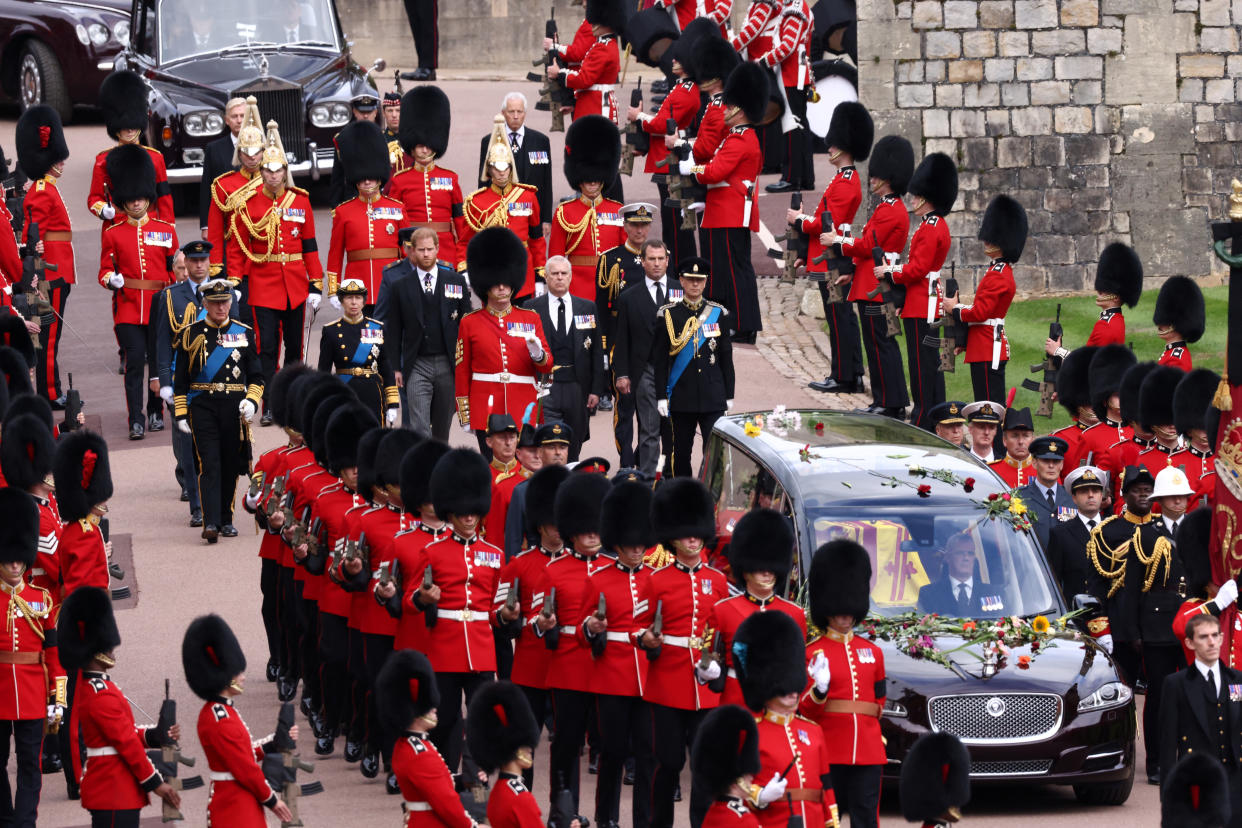 WINDSOR, ENGLAND - SEPTEMBER 19: The coffin of Queen Elizabeth II is carried in The state hearse as it proceeds towards St. George's Chapel followed by Prince Edward, Earl of Wessex, Prince Andrew, Duke of York, Anne, Princess Royal, King Charles III, Peter Phillips, Vice Admiral Sir Tim Laurence, Prince Harry, Duke of Sussex, Prince William, Prince of Wales, Prince Richard, Duke of Gloucester and David Armstrong-Jones, 2nd Earl of Snowdon on September 19, 2022 in Windsor, England. The committal service at St George's Chapel, Windsor Castle, took place following the state funeral at Westminster Abbey. A private burial in The King George VI Memorial Chapel followed. Queen Elizabeth II died at Balmoral Castle in Scotland on September 8, 2022, and is succeeded by her eldest son, King Charles III. (Photo by Henry Nicholls - WPA Pool/Getty Images)