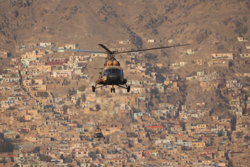 A military helicopter is pictured during the Taliban military parade in Kabul