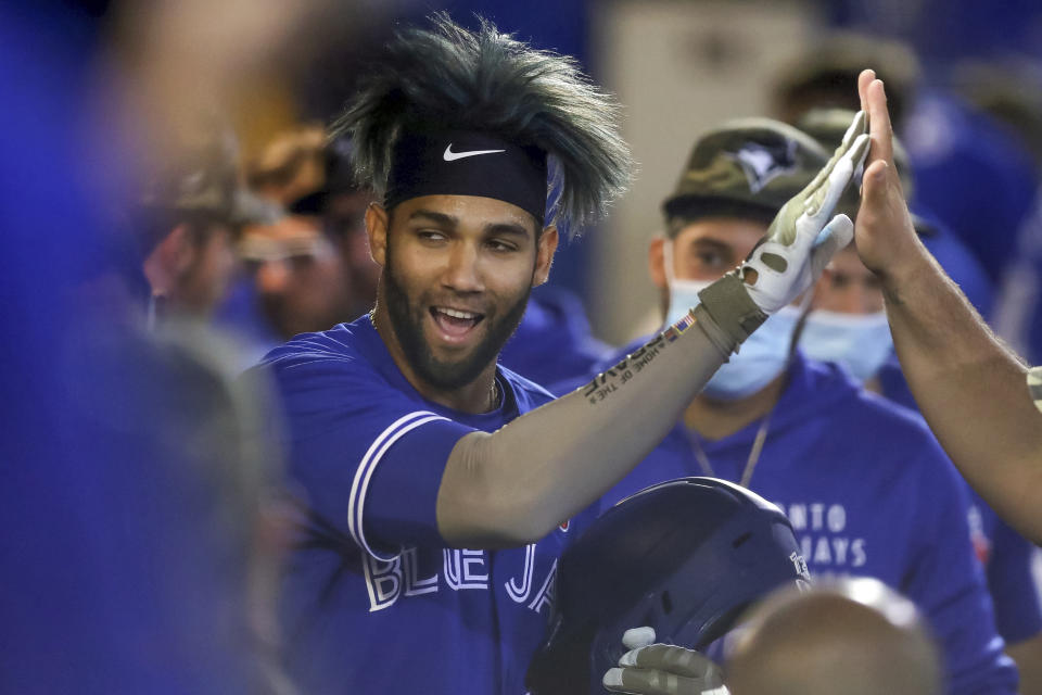 Toronto Blue Jays' Lourdes Gurriel Jr. celebrates after scoring against the Philadelphia Phillies during the second inning of a baseball game Saturday, May 15, 2021, in Dunedin, Fla. (AP Photo/Mike Carlson)