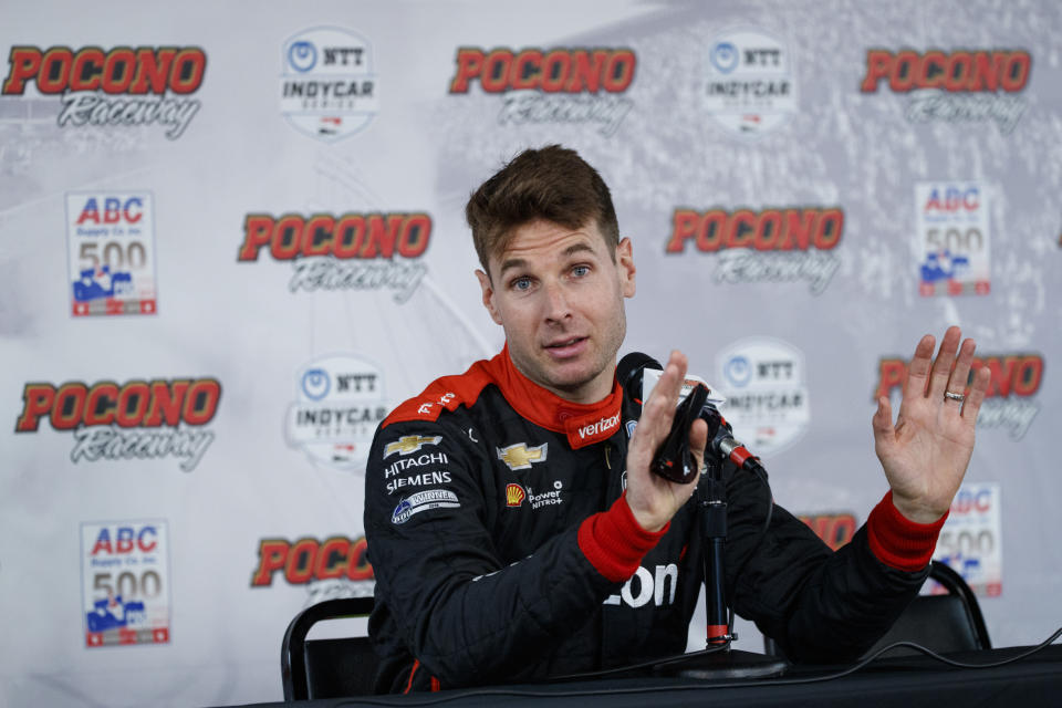 Will Power gestures whit speaking during a news conference for Sunday's IndyCar Series auto race at Pocono Raceway, Saturday, Aug. 17, 2019, in Long Pond, Pa. (AP Photo/Matt Slocum)