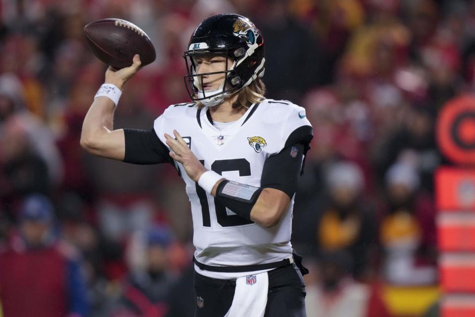 Jacksonville Jaguars quarterback Trevor Lawrence (16) sets to throw.