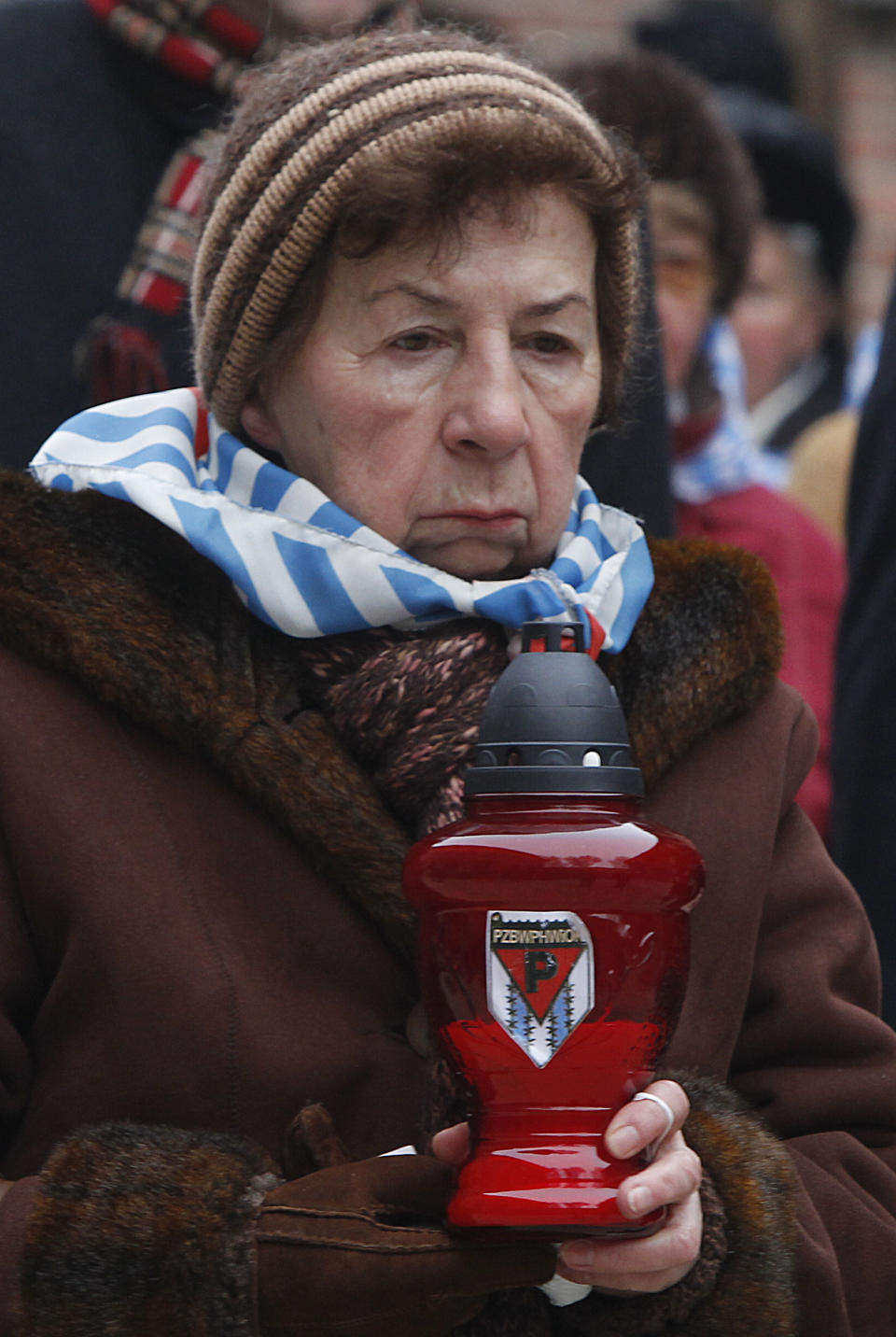 A Holocaust survivors arrives for a ceremony to mark the 69th anniversary of the liberation of Auschwitz Nazi death camp's in Oswiecim, Poland, on Monday, Jan. 27, 2014, since the Soviet Red Army liberated the camp. Israeli lawmakers and government officials are to attend anniversary observances later in the day. The Nazis killed some 1.5 million people, mostly Jews at the camp during World War II. (AP Photo/Czarek Sokolowski)