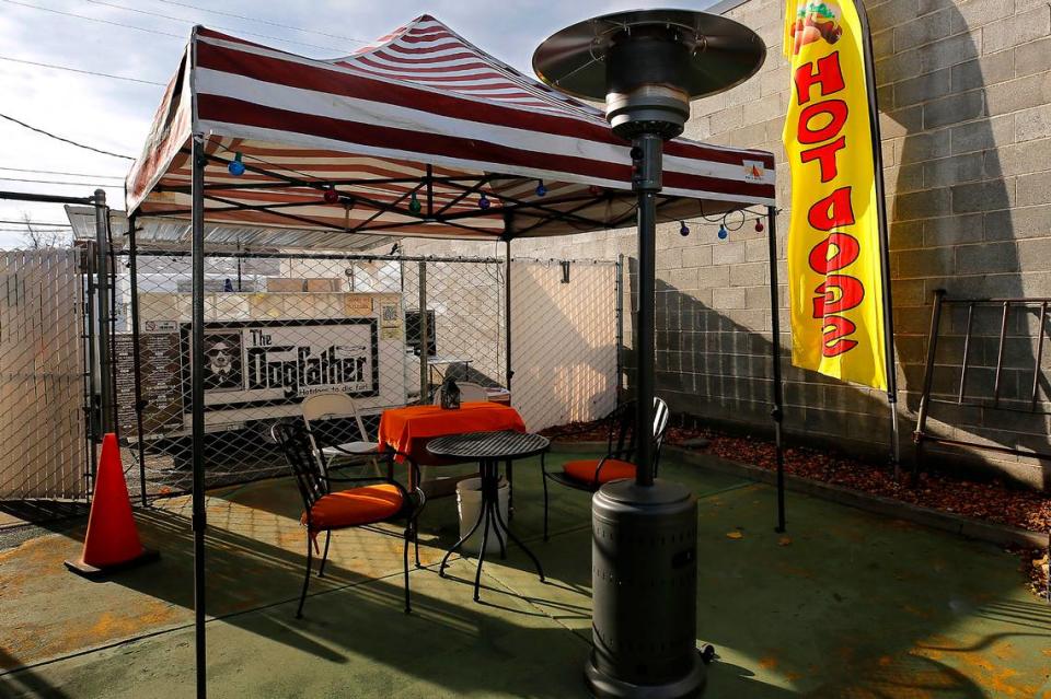 Dogfather owners Malinda Ralston and her fiance, Troy Collins, will serve up their popular hot dogs, hamburgers and more the first week of December .
