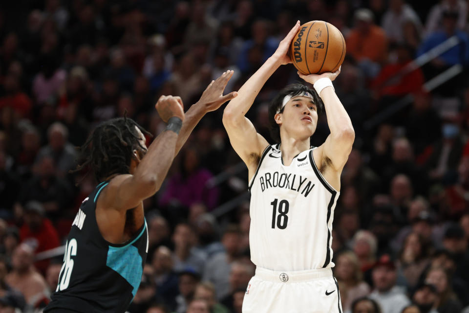 PORTLAND, OREGON - NOVEMBER 17: Yuta Watanabe #18 of the Brooklyn Nets shoots a three-point basket against the Portland Trail Blazers during the fourth quarter  at Moda Center on November 17, 2022 in Portland, Oregon. NOTE TO USER: User expressly acknowledges and agrees that, by downloading and or using this photograph, User is consenting to the terms and conditions of the Getty Images License Agreement. (Photo by Steph Chambers/Getty Images)