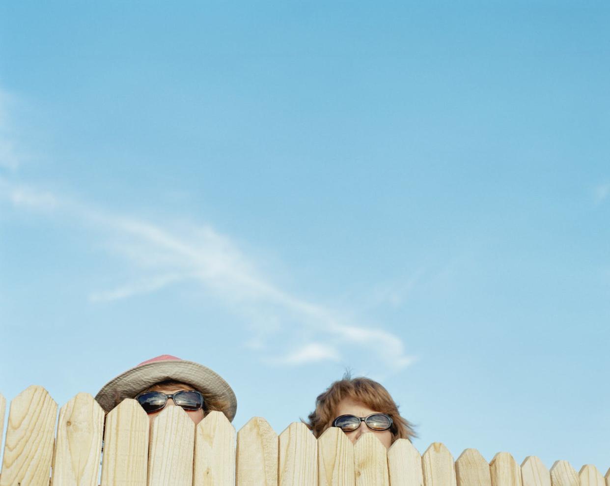 <span class="caption">Who's allowed to watch what you do and say?</span> <span class="attribution"><a class="link " href="https://www.gettyimages.com/detail/photo/two-women-looking-over-fence-royalty-free-image/200365509-005" rel="nofollow noopener" target="_blank" data-ylk="slk:Shannon Fagan/The Image Bank via Getty Images;elm:context_link;itc:0;sec:content-canvas">Shannon Fagan/The Image Bank via Getty Images</a></span>