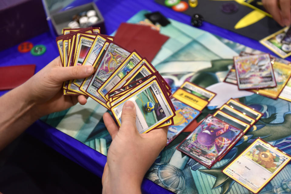 LONDON, ENGLAND - AUGUST 18: A competitor holds a deck containing a Quick Ball card while playing Pokemon cards during the 2022 Pokémon World Championships at ExCel on August 18, 2022 in London, England. For the first time in history, the championship event is being held outside of North America, London Excel will host the competition on August 18–21. Some of the best Pokémon players from around the will compete in Pokémon TCG, the Pokémon Sword and Pokémon Shield video games, Pokémon GO, Pokémon UNITE, and Pokkén Tournament DX. Half a million dollars in prizes, the title of Pokémon World Champion, and return invitations for the following year's Worlds are up for grabs. (Photo by John Keeble/Getty Images)