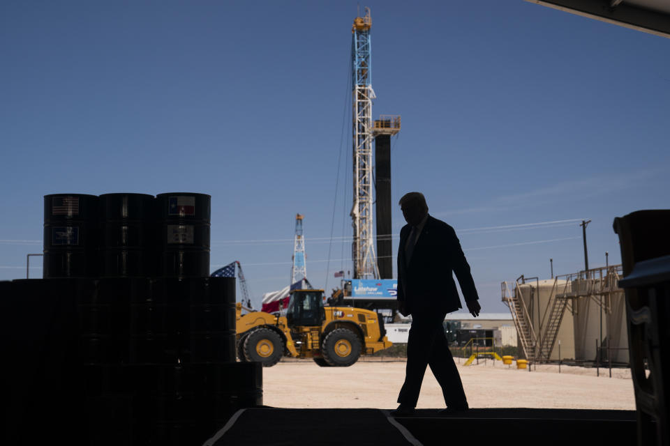 FILE - In this July 29, 2020, file photo President Donald Trump arrives to deliver remarks about American energy production during a visit to the Double Eagle Energy Oil Rig in Midland, Texas. Trump, like many fellow Republicans, holds out tax reductions and regulatory cuts as economic cure-alls and frames himself as a conservative champion in seemingly endless culture wars. But the president, still trying to fashion himself as an outsider, offers little detail about how he’d pull the levers of government in a second term. (AP Photo/Evan Vucci, File)