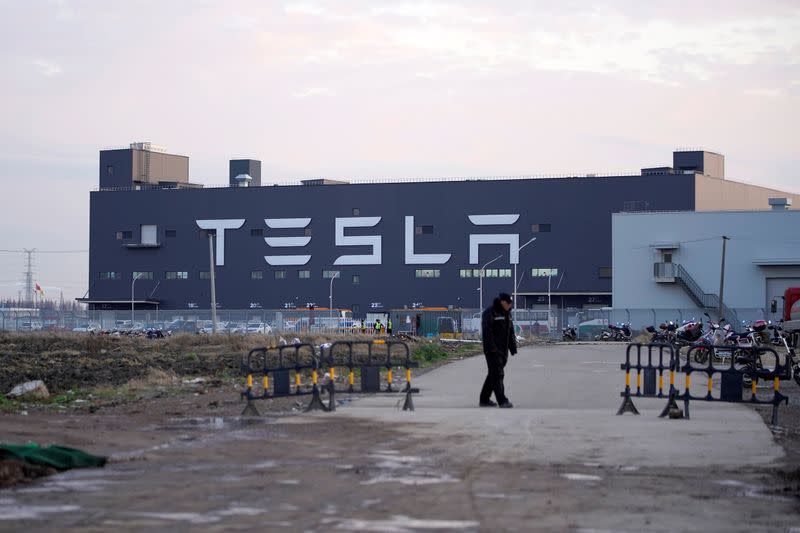 A Tesla sign is seen on the Shanghai Gigafactory of the U.S. electric car maker before a delivery ceremony in Shanghai