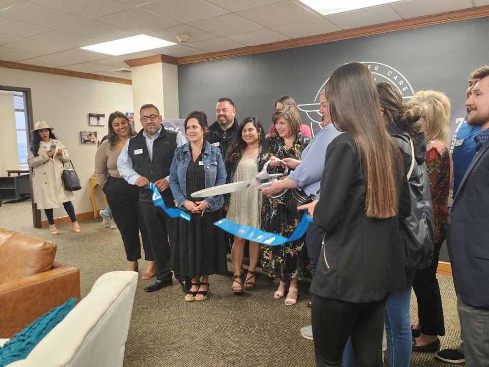 Amarillo Angels Executive Director Gwen Hicks celebrates the organization's seventh anniversary with a grand opening of its new office and ribbon cutting with the Amarillo Hispanic Chamber of Commerce held Wednesday afternoon.