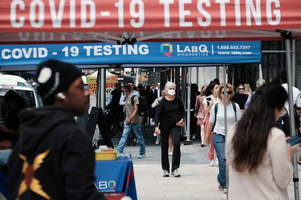  People walk past a Covid testing site on May 17, 2022 in New York City. (Getty Images)