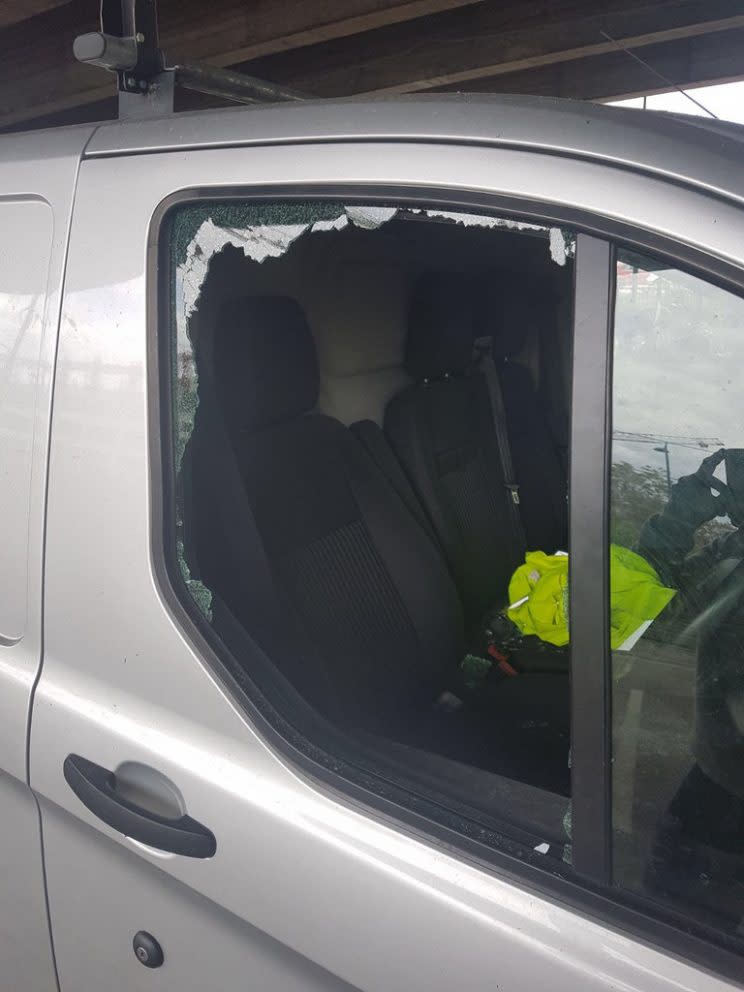 The van's windows were left shattered (Picture: SWNS)