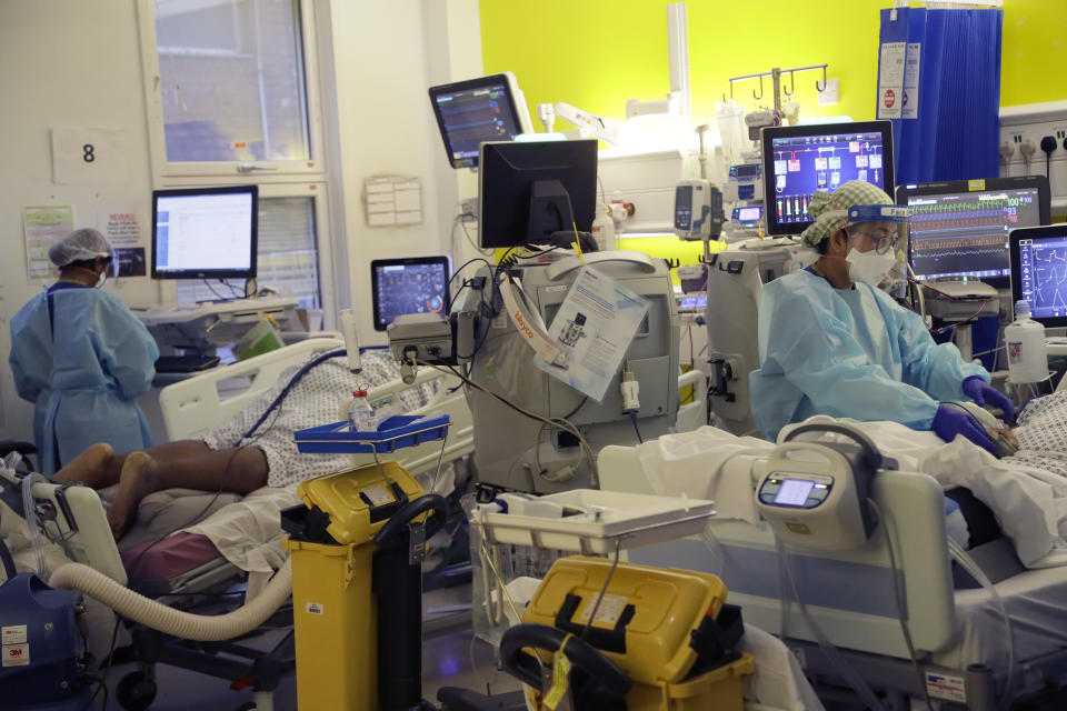 Critical Care staff take care of COVID-19 patients on the Christine Brown ward at King's College Hospital in London, Wednesday, Jan. 27, 2021. (AP Photo/Kirsty Wigglesworth, pool)