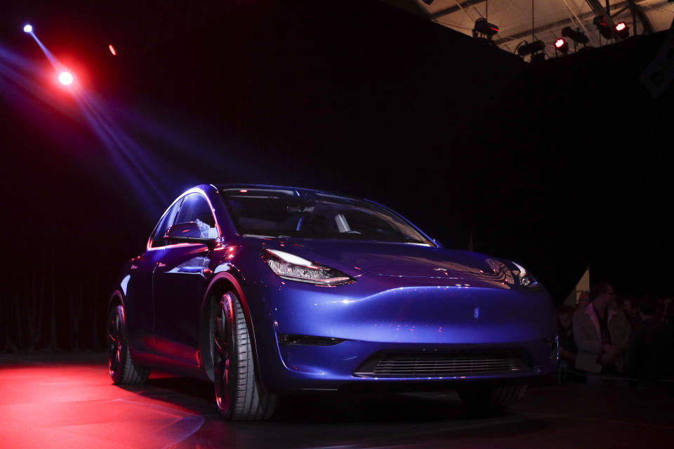 FILE - In this March 14, 2019, file photo the Tesla Model Y is unveiled at Tesla's design studio in Hawthorne, Calif. A Delaware judge is weighing whether to dismiss Tesla shareholders' complaints over a compensation plan that could net CEO Elon Musk more than $50 billion over the next decade. (AP Photo/Jae C. Hong, File)