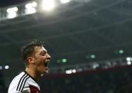 Germany's Mesut Ozil celebrates scoring his team's second goal against Algeria during extra time in their 2014 World Cup round of 16 game at the Beira Rio stadium in Porto Alegre June 30, 2014. REUTERS/Darren Staples