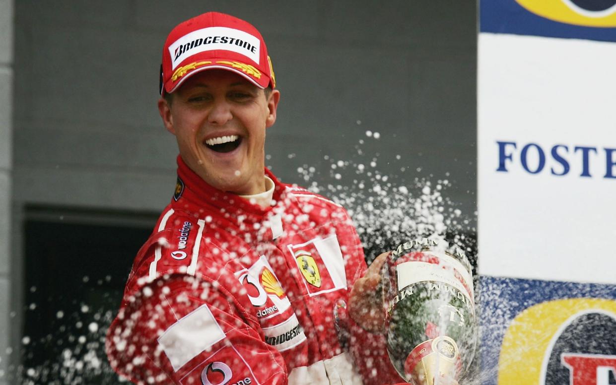 Michael Schumacher of Germany and Ferrari celebrates winning the 2004 Formula One British Grand Prix - Getty Images