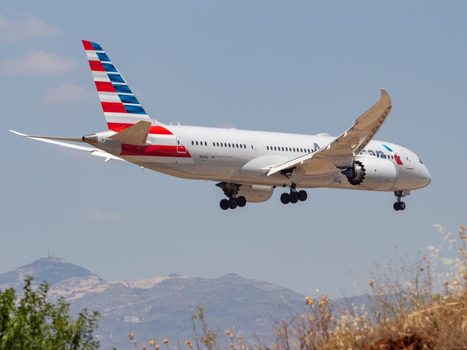 An American Airlines plane flying.