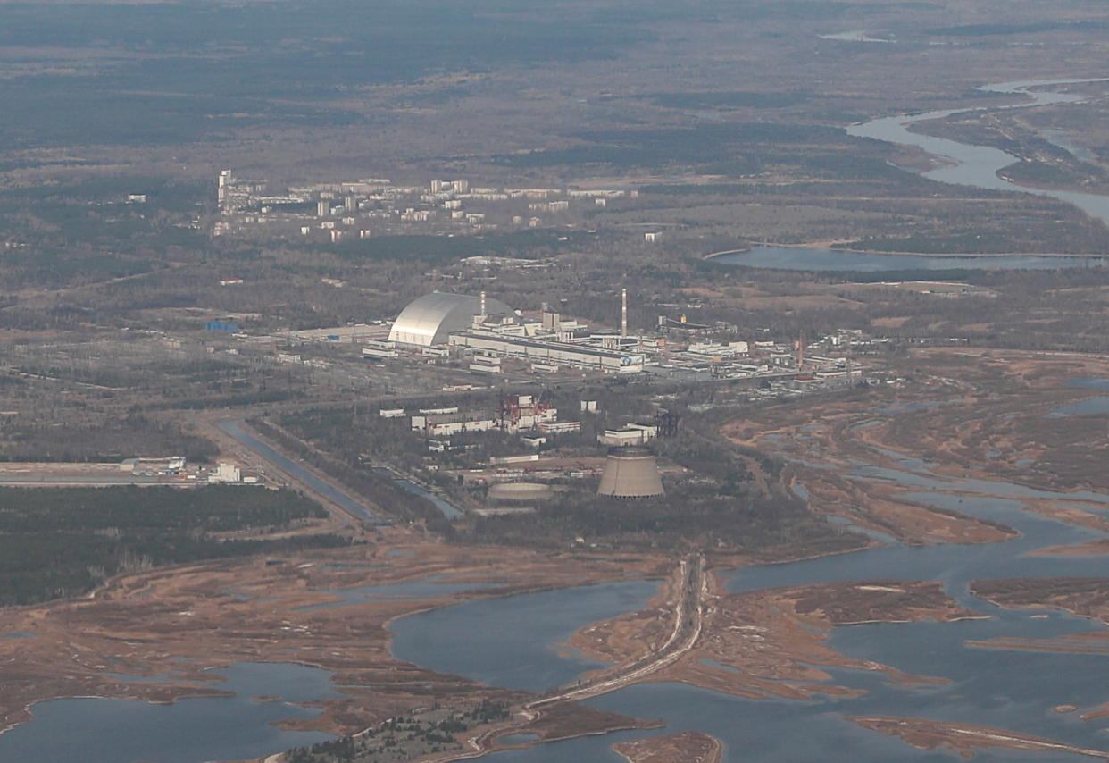 An aerial view shows the New Safe Confinement structure covering the damaged No. 4 reactor.
