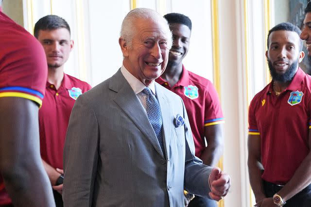 <p>YUI MOK/POOL/AFP via Getty</p> King Charles III with the West Indies men's cricket team in London on July 6, 2024