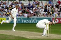 <p>Fearsome sight: Courtney Walsh puts the frighteners on Graeme Hick in 2000<br></p>