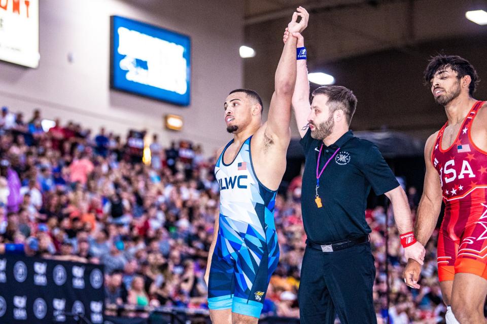 Aaron Brooks has his arm raised in victory after defeating Zahid Valencia 10-6 for the 86-kilogram title at the U.S. Open in Las Vegas on Friday night.