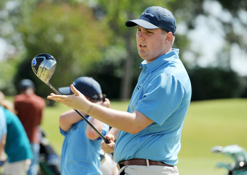 In 2018, Special Olympics golfer Fletcher Schaier, then 21, inspects his new driver as he tries it out on the range of the Hidden Hills Country Club. The Players Championship donated to the Special Olympics golf program and bought new sets of clubs for some of the athletes.