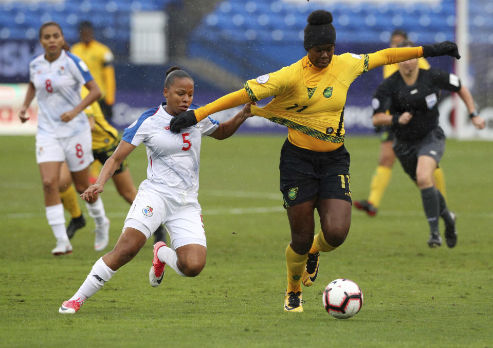 Panama midfielder Katherine Castillo (4) and Jamaica midfielder Khadija Shaw battle for the ball during the first half of the third place match of the CONCACAF women's World Cup qualifying tournament, Wednesday, Oct. 17, 2018, in Frisco, Texas. (AP Photo/Richard W. Rodriguez)