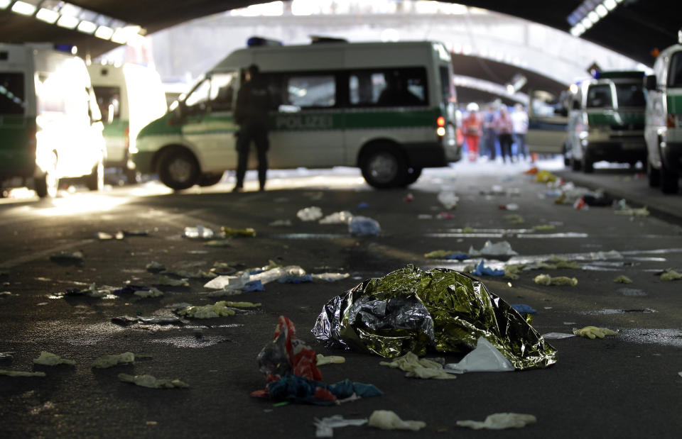 FILE - In this July 24, 2010 file picture a thermal blanket lies on the ground in a tunnel after a mass panic in Duisburg, Germany. German prosecutors say they have indicted 10 people on charges including involuntary manslaughter over a mass panic at the Love Parade techno music festival nearly four years ago that resulted in 21 deaths. Duisburg prosecutor Horst Bien said Wednesday Feb. 12, 2014 that four employees of the event's organizers and six city workers have been indicted. They face charges of involuntary manslaughter and bodily harm, punishable with up to five years jail time. (AP Photo/Michael Sohn,File)