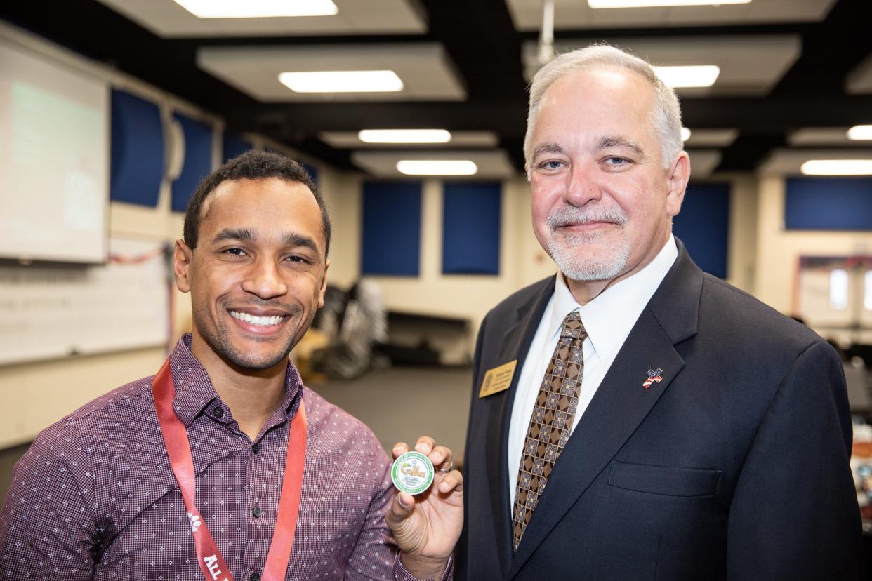 Georgia Superintendent Richard Woods, right, named Woodland High School teacher Michael Kobito Georgia's Teacher of the Year on Saturday, April 30, 2022.