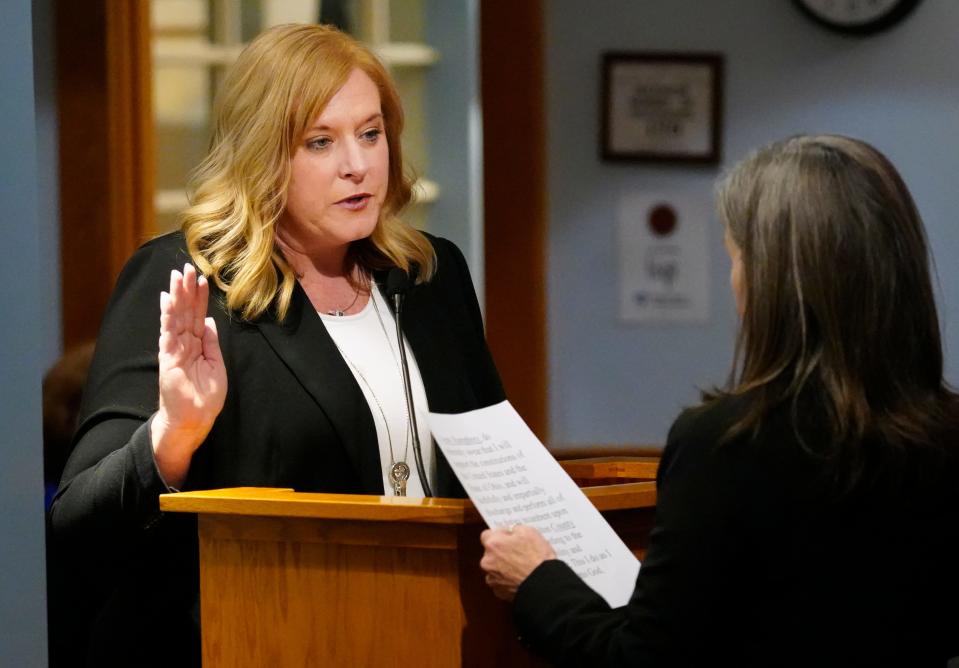 Hamilton County Commissioner Denise Driehaus swears in Chief Deputy Auditor Amy Humphrey as the interim auditor following the resignation of Brigid Kelly, the auditor for the past two years.