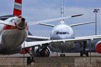 American Airlines planes are parked at Pittsburgh International Airport in Imperial, Pa., on Tuesday, March 31, 2020. As airlines cut more service, due to the COVID-19 pandemic, Pittsburgh International Airport has closed one of its four runways to shelter in place 96 planes, mostly from American Airlines, as of Monday, March 30, 2020. The airport has the capacity to store 140 planes.(AP Photo/Gene J. Puskar)