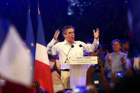 Francois Fillon, former French prime minister, member of The Republicans political party and 2017 presidential candidate of the French centre-right, attends a political rally in Saint-Pierre as he campaigns on the French Indian Ocean island of the Reunion, February 12, 2017. REUTERS/Laurent Capmas