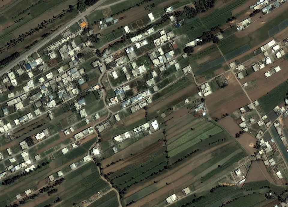 This June 15, 2005 satellite image provided by DigitalGlobe shows the compound, lower right, in Abbottabad, Pakistan, where Osama bin Laden lived. Bin Laden, the face of global terrorism and mastermind of the Sept. 11, 2001, attacks, was tracked down and shot to death at the compound by an elite team of U.S. forces on Monday, May 2, 2011, ending an unrelenting manhunt that spanned a frustrating decade. (AP Photo/DigitalGlobe)