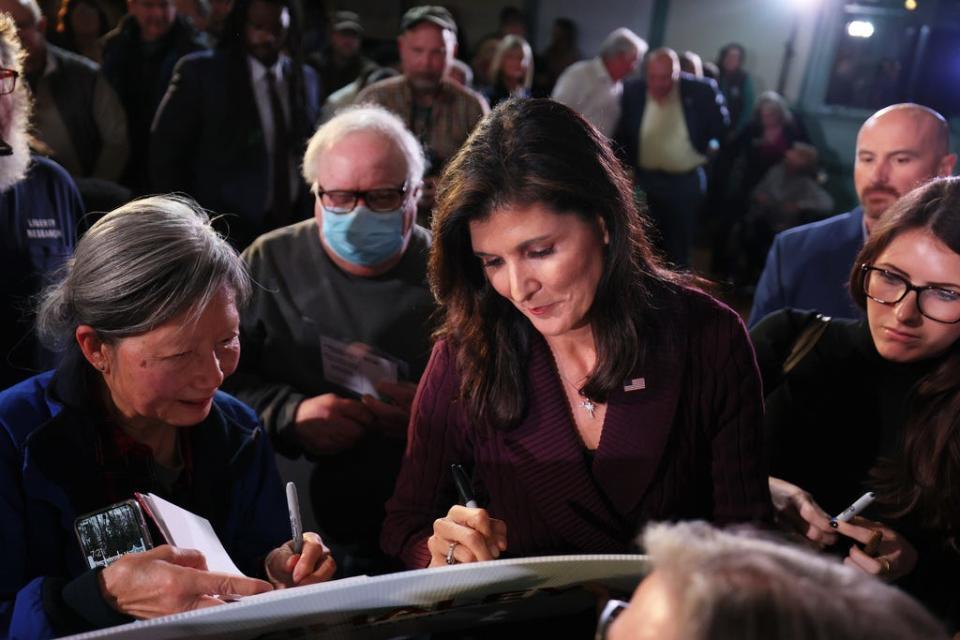 Republican presidential candidate Nikki Haley signs autographs for supporters after speaking during a campaign event at Exeter Town Hall on February 16, 2023 in Exeter, New Hampshire.
