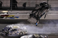 Ryan Newman (6) goes airborne after crashing into Corey LaJoie (32) during the NASCAR Daytona 500 auto race Monday, Feb. 17, 2020, at Daytona International Speedway in Daytona Beach, Fla. Sunday's running of the race was postponed by rain. (AP Photo/Chris O'Meara)