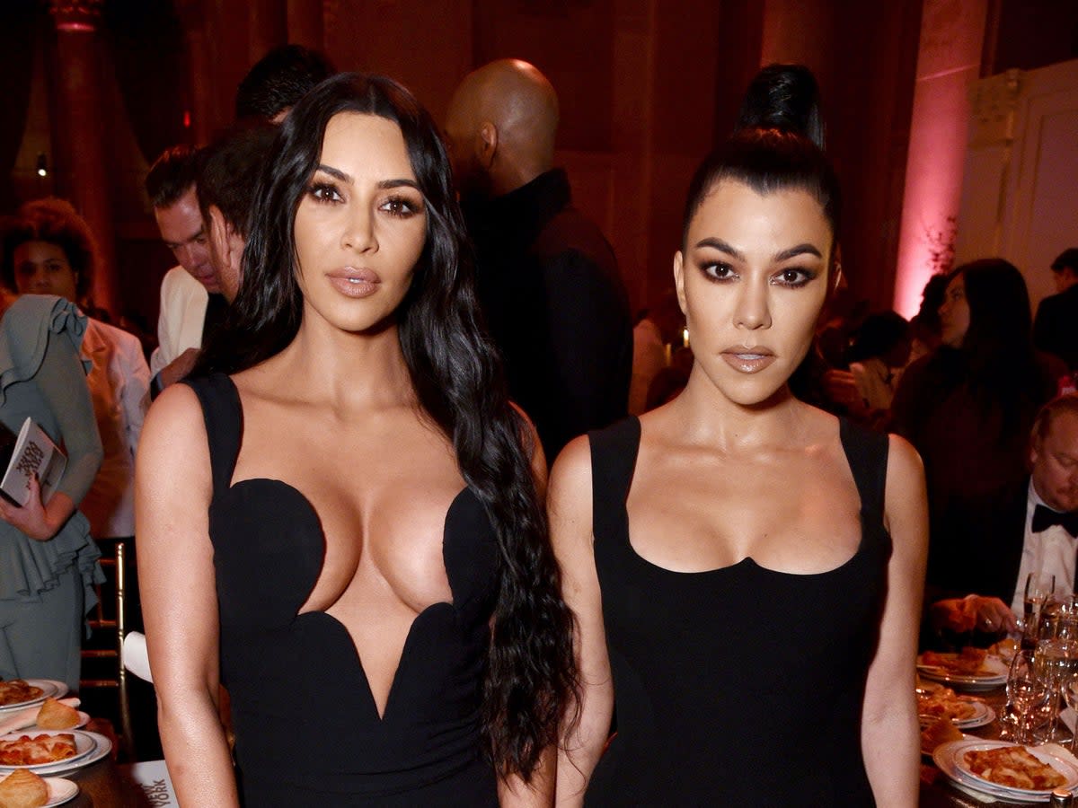 Kim Kardashian (left) with her sister, Kourtney (Getty Images for Perrier-JouÃ«t a)
