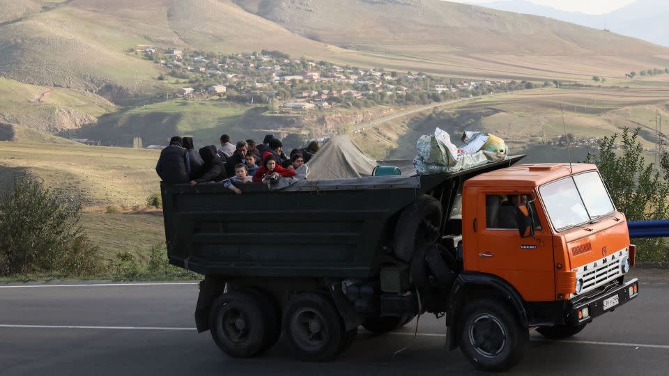 A truck carries refugees from Nagorno-Karabakh on September 28. More than 100,000 Armenians fled the enclave in the days after Azerbaijan's lightning offensive. - Alain Jocard/AFP/Getty Images